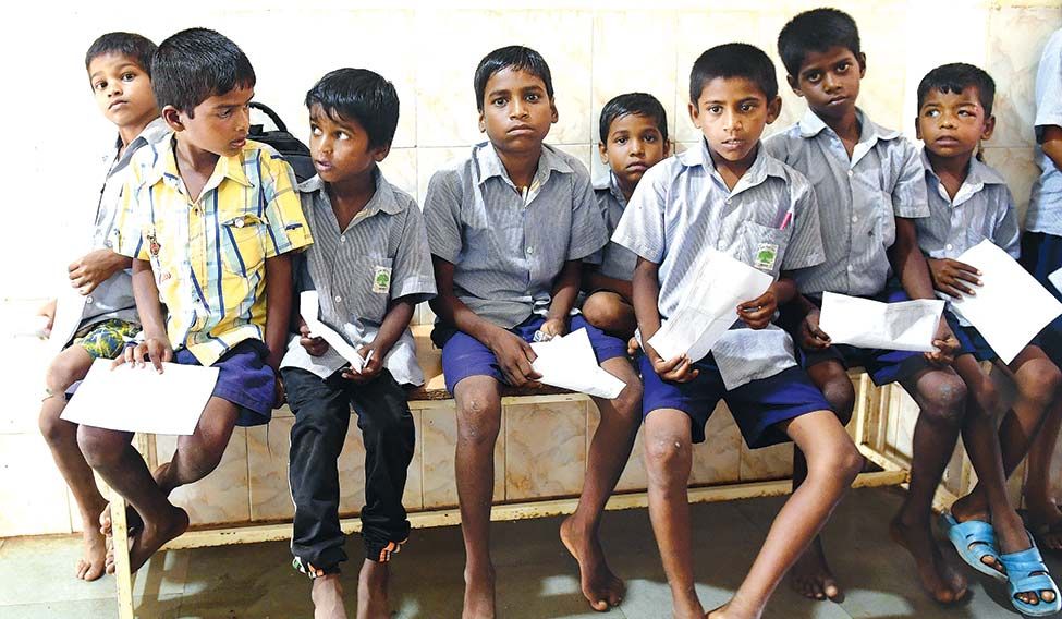 Prevention is better than cure: Tribal school children wait for health checkups at the local hospital in Mokhada. Mouthful of misery