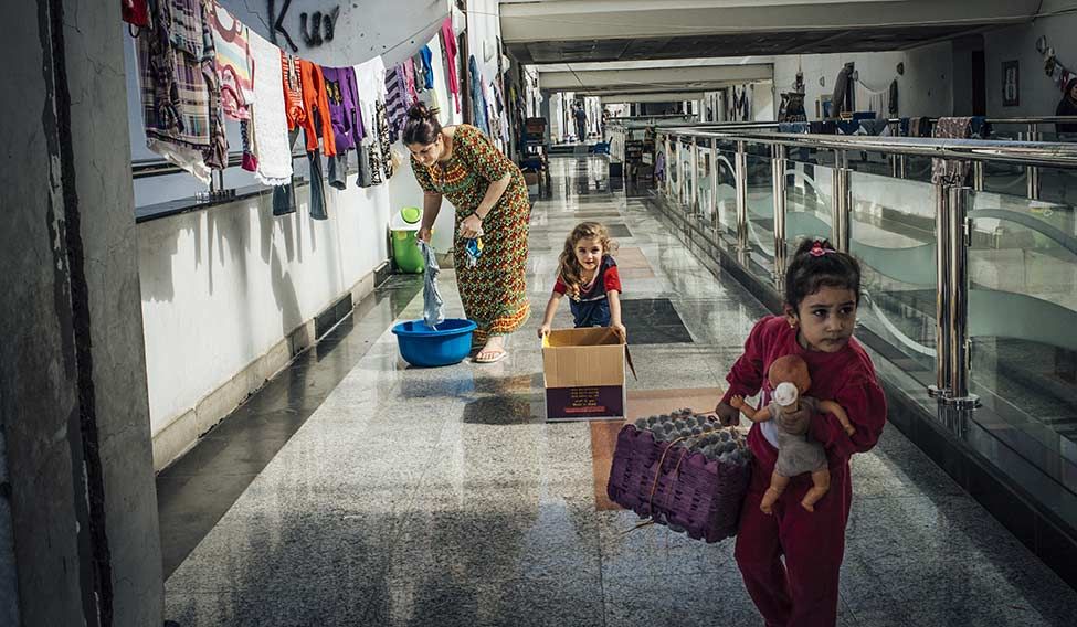 Scene at a shopping mall in Erbil, where many Christian families from Bartella and Qaraqosh moved in after IS seized the cities in 2014. The two cities were liberated in October this year. Country at crossroads