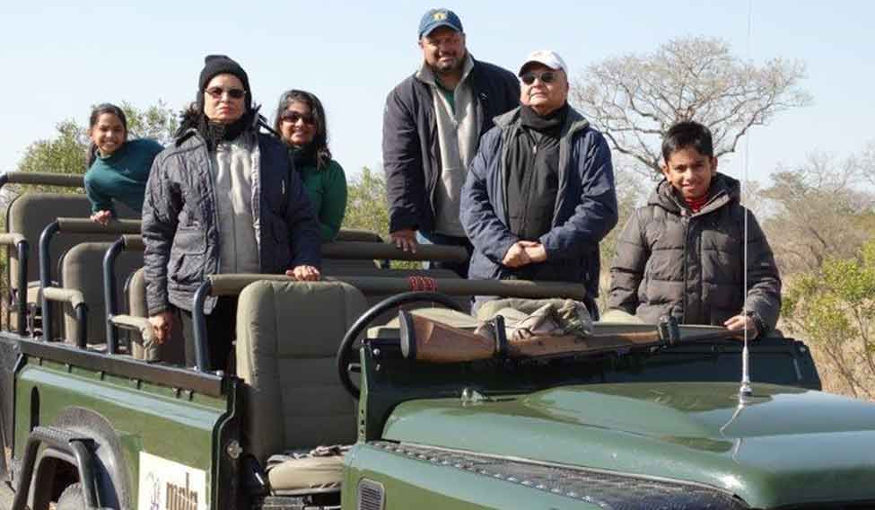 Spot on: Sanjay Khandwala (second, from right) with his family in South Africa. 'Click' and save