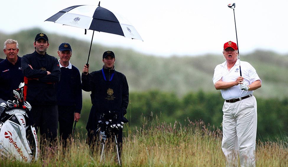 Driving seat: The avid golfer at the Trump International Golf Links in Aberdeen, Scotland. Trump towers