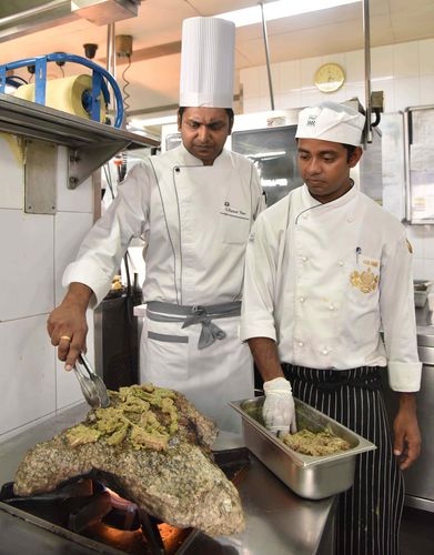 Executive chef Sajesh Nair (left) preparing Pathar Ka Gosht at Adaa | Mohammed Aleemuddin Innovation on my plate