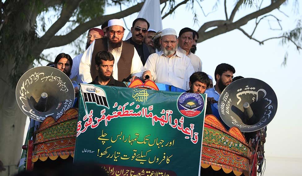 Hot pursuit: Hafiz Saeed (wearing glasses and skull cap), founder of Lashkar-e-Taiba, at a public meeting in Islamabad. Trump is likely to adopt a harsh stance against terrorist groups | Reuters The great disruptor