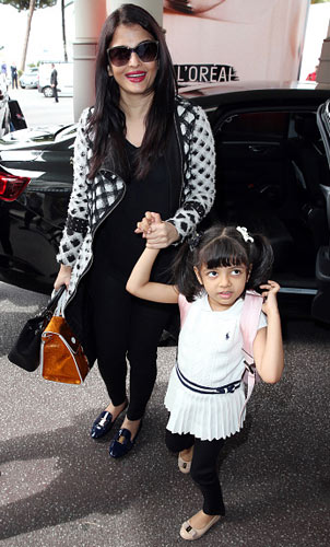 When not in school, Aaradhya (in pic) accompanies her mother, Aishwarya, to shoots and keeps herself engaged at ‘the bus office’ | Getty Images Heart and craft