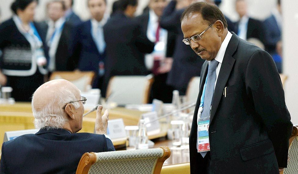 Building bridges: India’s National Security Adviser Ajit Doval (right) with Sartaj Aziz, Pakistan PM’s adviser on foreign affairs | PTI Summer thaw