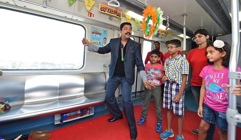 Children taking part in a magic show. Fun on rail