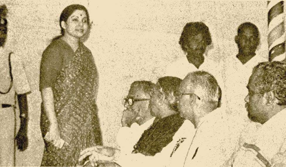 A running feud. Jayalalitha and Veerappan at a public meeting Two men, two women