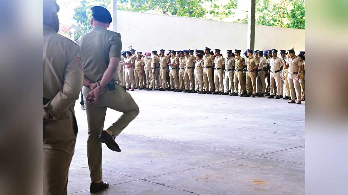 All lined up: Police personnel wait ahead of the recent Cockroach Janta Party protest in Bengaluru. Some were seen stretching their legs after standing for long | Bhanu Prakash Chandra