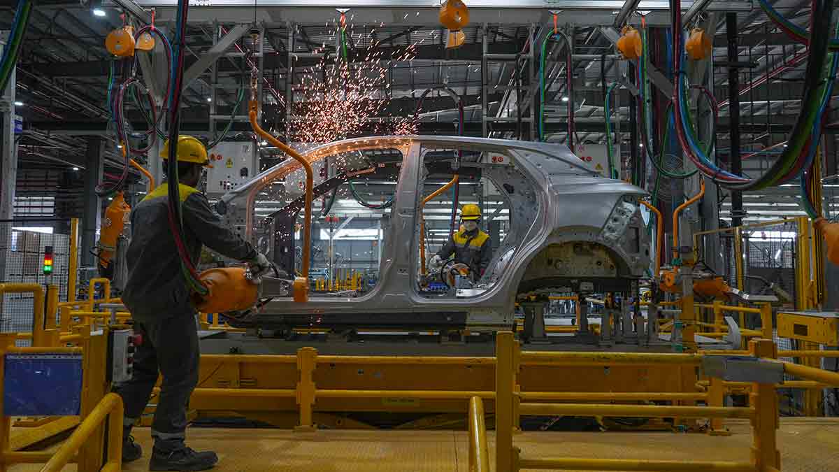Shaping up: Workers assemble a car at the Vinfast electric vehicle plant in Thoothukudi, Tamil Nadu | AP