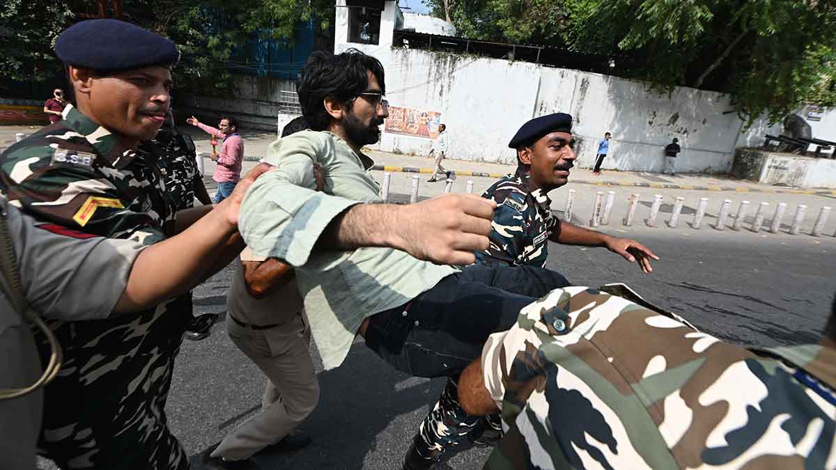 In the line of duty: Badar being carried away by policemen during the protest on October 10 | Kritajna Naik