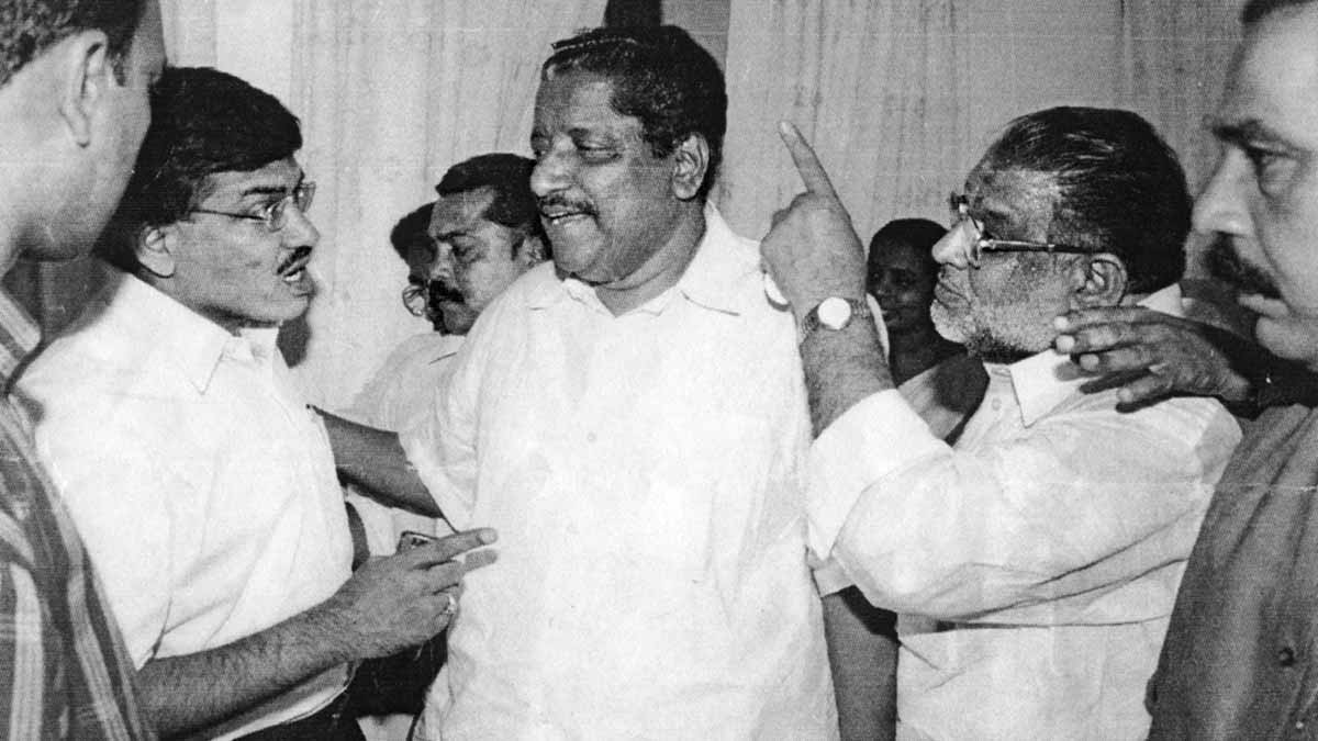 Stormy days: A file photo of the contentious March 2004 meeting attended by (from left) Gyanesh Kumar, minister T.M. Jacob and legislator T.H. Musthafa | Manoarama Archives