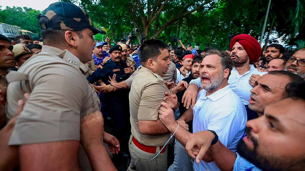 Anger in the air: Policemen detaining Rahul Gandhi during a sit-in protest near the prime minister’s residence in Delhi on July 21 | PTI
