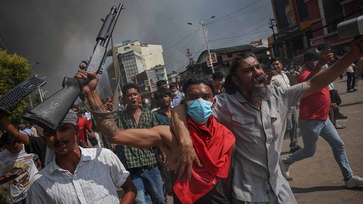Raging high: Protesters display Bangladesh’s national flag as they storm prime minister Sheikh Hasina’s palace in Dhaka on August 5, 2024 | AFP