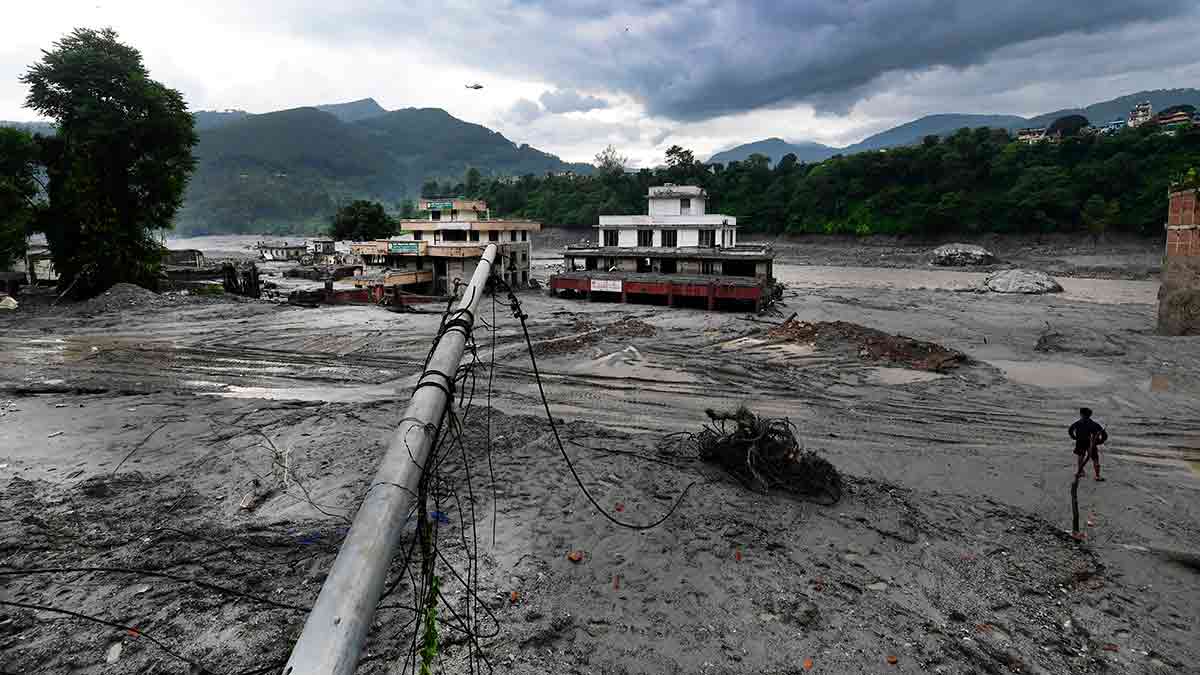 Ravaged land: Buildings destroyed by floodwaters at Dhunge.