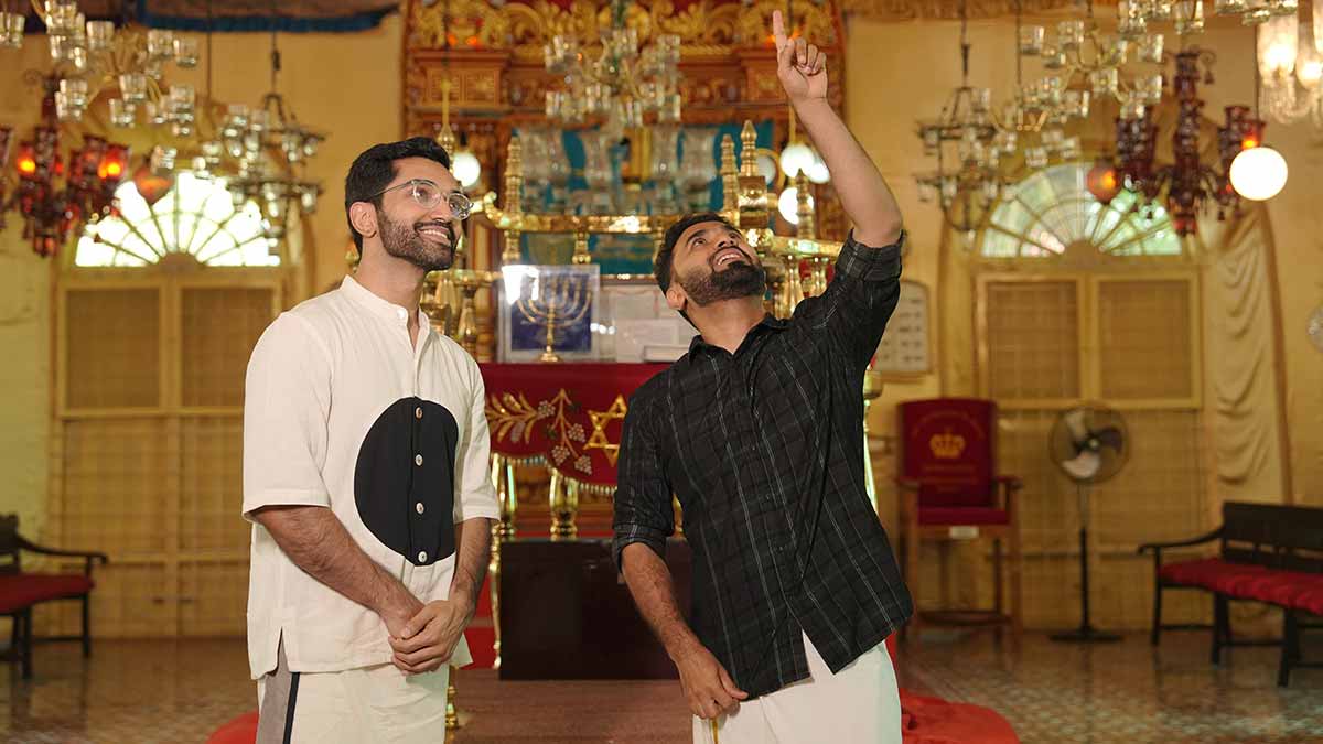 A lesson to remember: Manu S. Pillai (left) with historian Thoufeeq Zakriya, who explains Kerala’s Jewish heritage. A still from the SAGA documentary series | ARPO