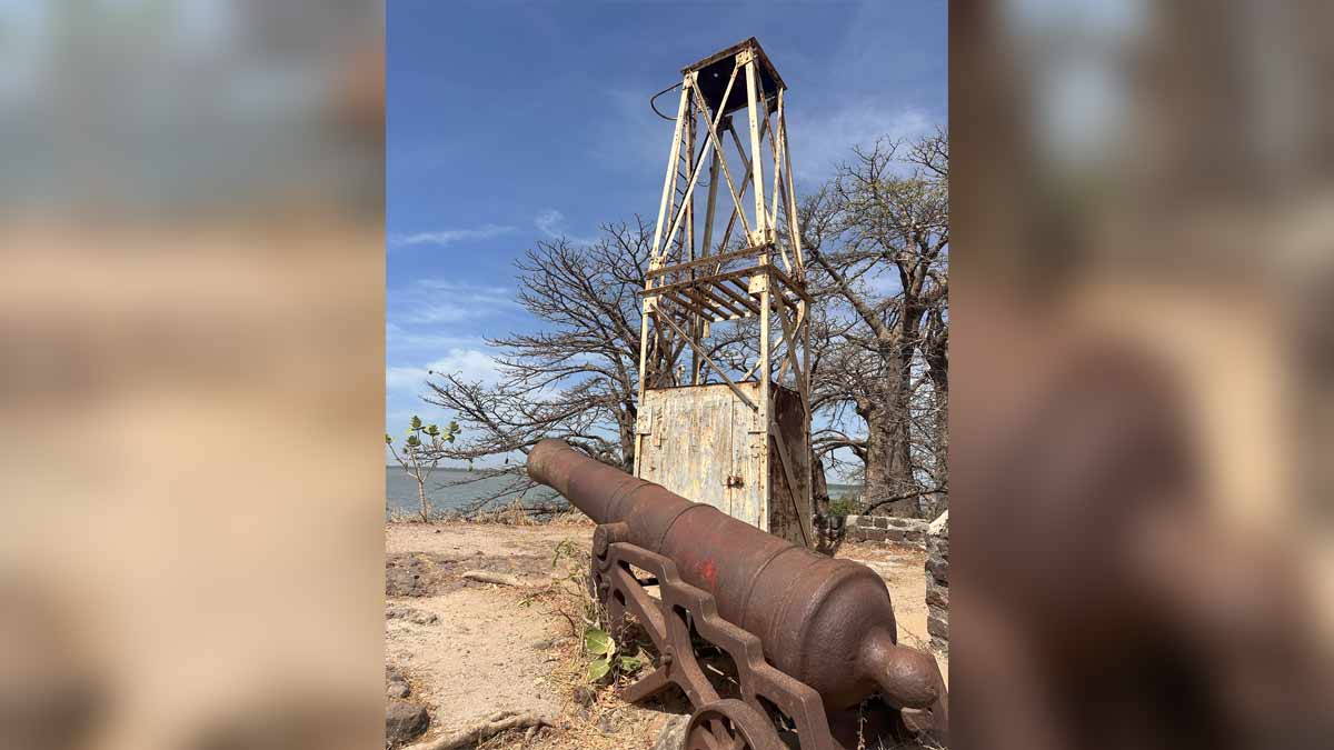 Silent witnesses: A watchtower and cannon on the island with the baobab trees in the background.