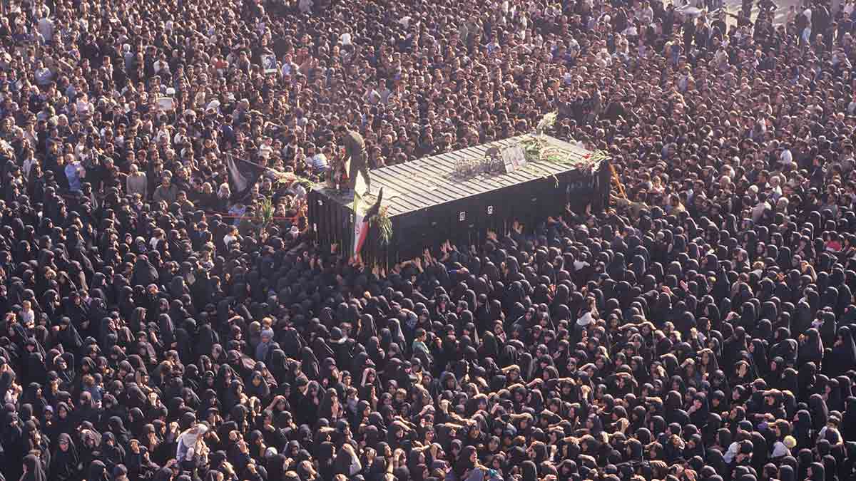 Man of the masses: Mourners gather around a container holding the body of Ayatollah Khomeini, in his final resting place near Behesht Zahra cemetery in Tehran, on June 6, 1989 | Getty Images