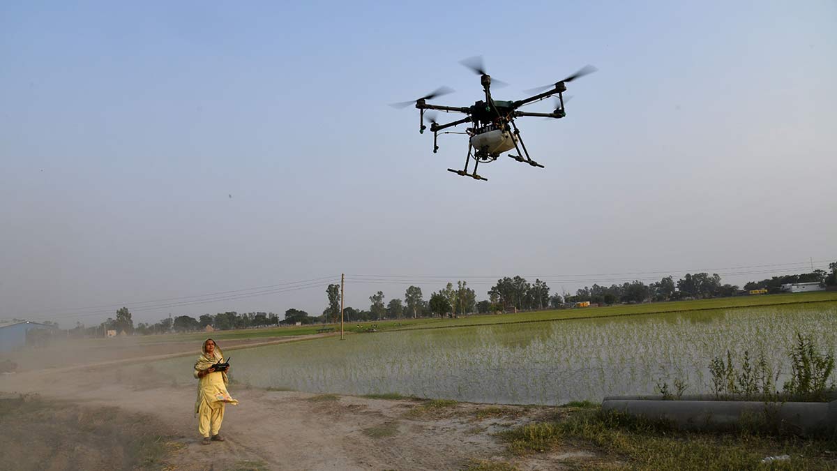 Hope, a thing with propellers: Geeta Devi flies a drone at a field in Achala village in Haryana | Sanjay Ahlawat