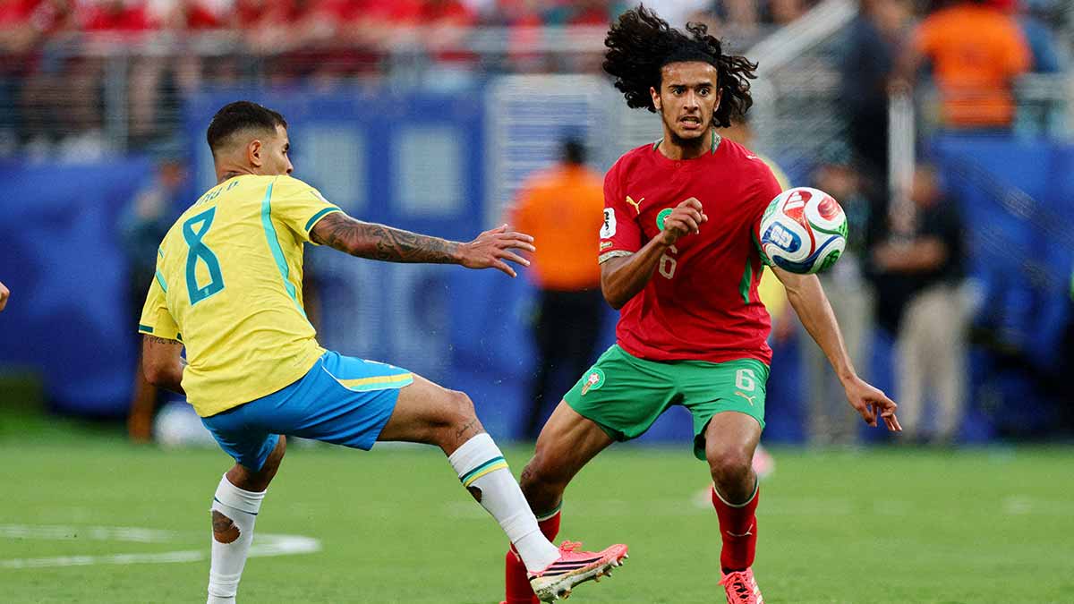 Teen titan: Morocco’s Ayyoub Bouaddi (in red) against Brazil | Reuters