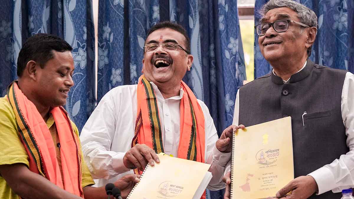 New beginnings: West Bengal Chief Minister Suvendu Adhikari (centre) with Finance Minister Swapan Dasgupta (right) and legislator Anandamay Barman after the budget presentation on June 22 | PTI