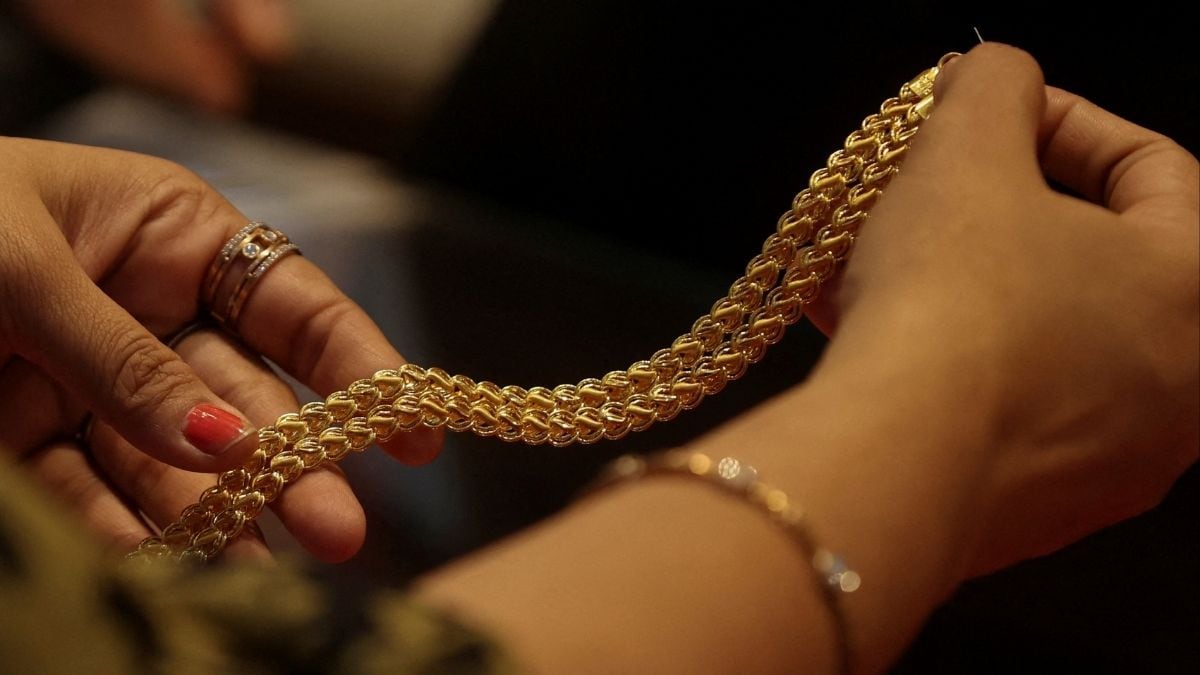 File: A customer holds a gold chain at a jewellery store in Mumbai, India, January 30, 2026. | REUTERS