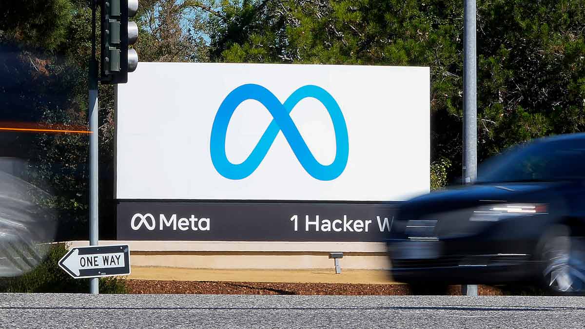 A car passes Facebook's new Meta logo on a sign at the company headquarters in Menlo Park | AP