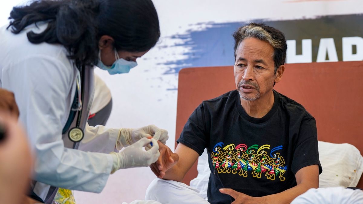 Climate activist Sonam Wangchuk being attended by a medical professional during a protest by Cockroach Janata Party (CJP) at the Jantar Mantar, in New Delhi | PTI
