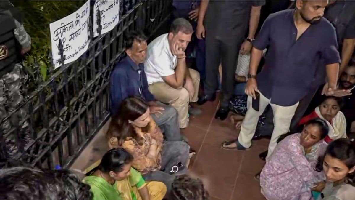 Lok Sabha Leader of Opposition (LoP) Rahul Gandhi sits with the parents of Ankita Bhandari during a sit-in protest at India Gate in New Delhi | PTI