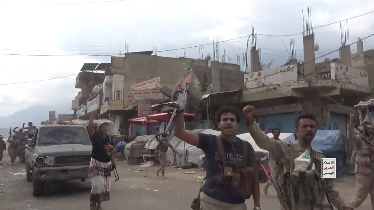 Armed Houthi fighters march on the streets of Jabal Habshi district, Taiz Governorate, Yemen | Reuters