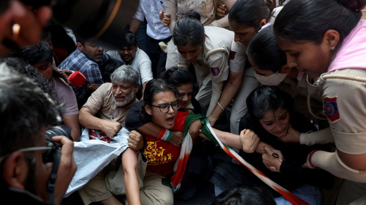 Neha Bora, National President of the All India Students' Association (AISA), reacts as she is detained by police during a protest demanding the resignation of India's Chief Election Commissioner Gyanesh Kumar, in New Delhi | PTI