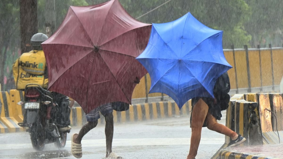 People use umbrellas to shield themselves from strong winds as Cyclone Arnab approaches the Andhra Pradesh coast, in Visakhapatnam, India, Tuesday, Oct. 27, 2026 | AP