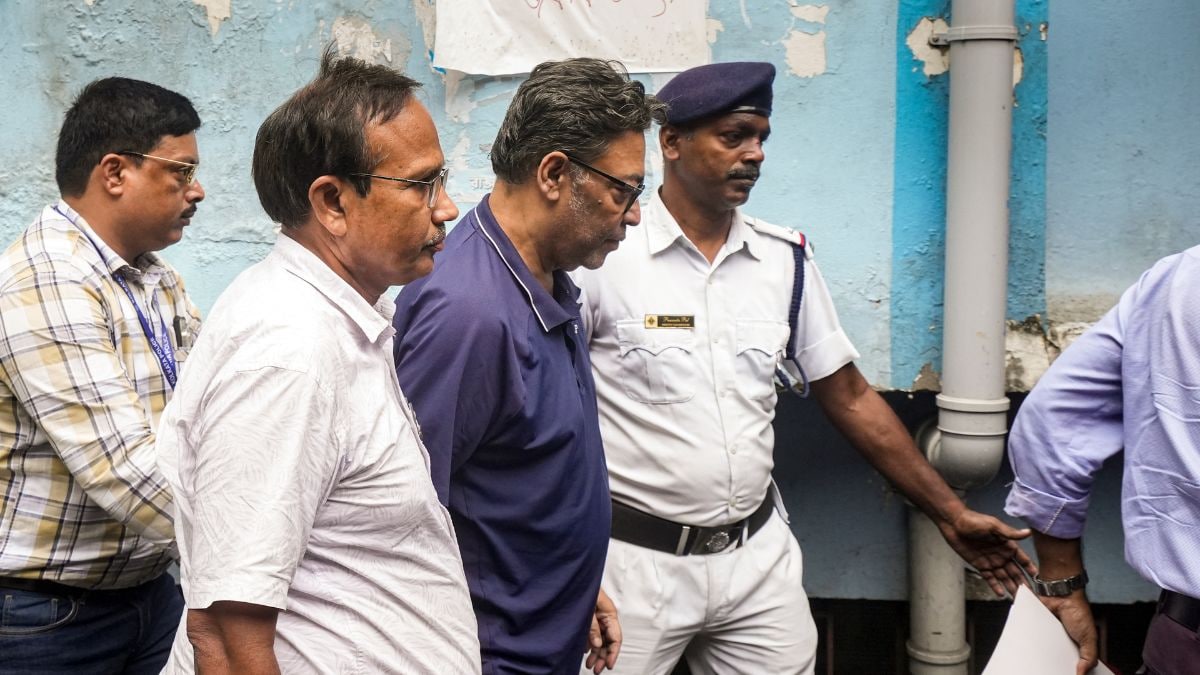 Police personnel produce former West Bengal minister Indranil Sen before a city court, in Kolkata on Oct 29, 2026 | PTI