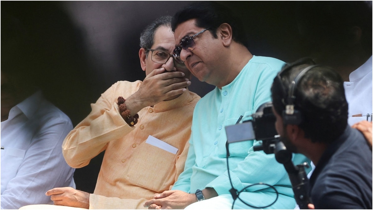 Uddhav Thackeray, president of Shiv Sena (UBT), speaks with Raj Thackeray, president of the Maharashtra Navnirman Sena (MNS), during a protest demanding the resignation of India's Chief Election Commissioner Gyanesh Kumar | PTI