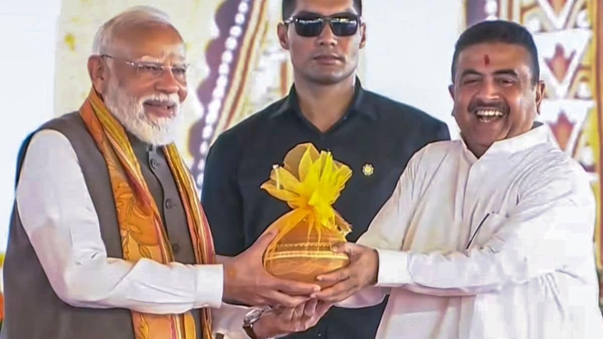 Prime Minister Narendra Modi being greeted by West Bengal Chief Minister Suvendu Adhikari during the 'Paschimbanga Divas' (West Bengal Day) celebration at Tarakeswar | PTI