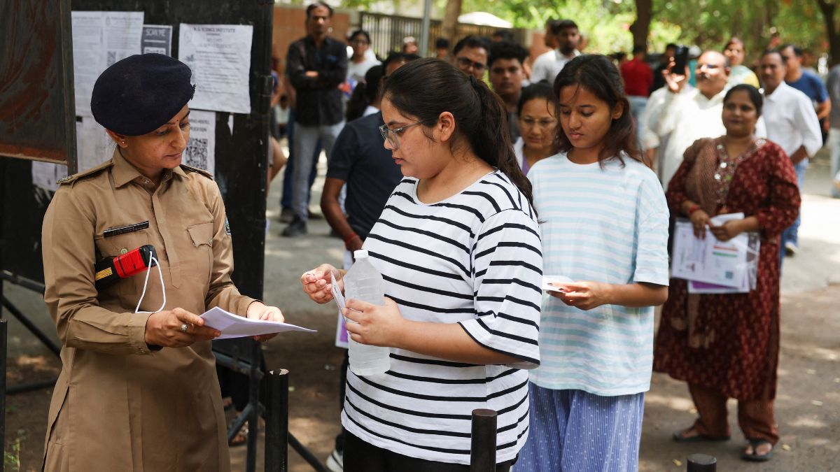 Representative image of students being checked before writing the NEET re-test on June 21, 2026 | Reuters