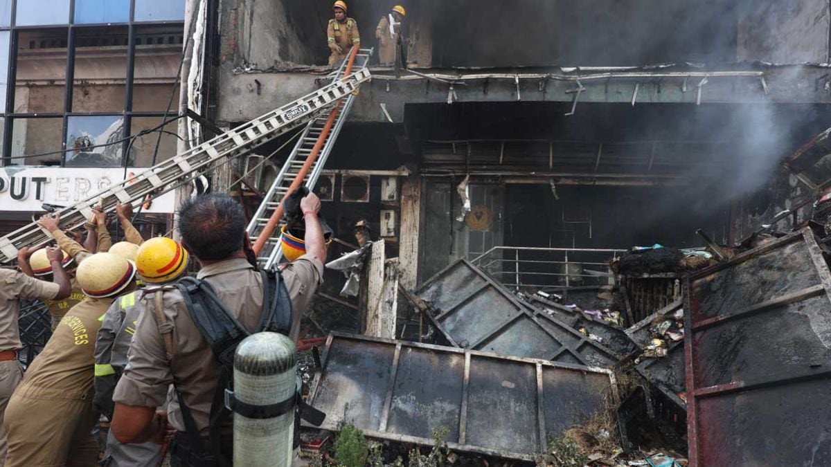 Firefighters carry out a rescue operation after a fire broke out in a commercial complex in Aliganj, Lucknow | PTI
