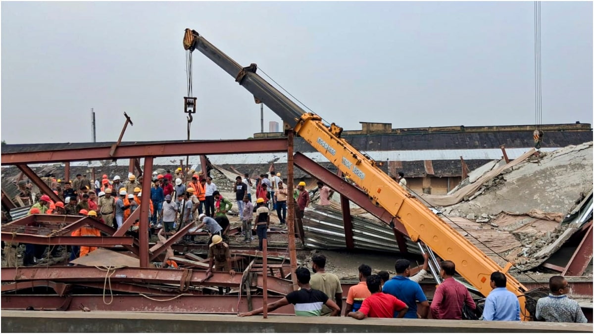 Rescue personnel during an operation after a three-storey under-construction warehouse collapsed in the Taratala area | PTI