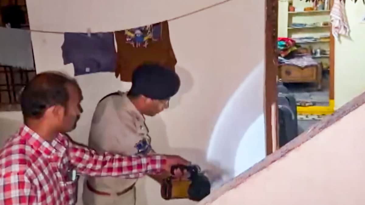 A police official during inspection after a man allegedly killed six people, including his wife, two children and three members of the family that had filed a POCSO case against him, in Shabad, Rangareddy district, Telangana | PTI