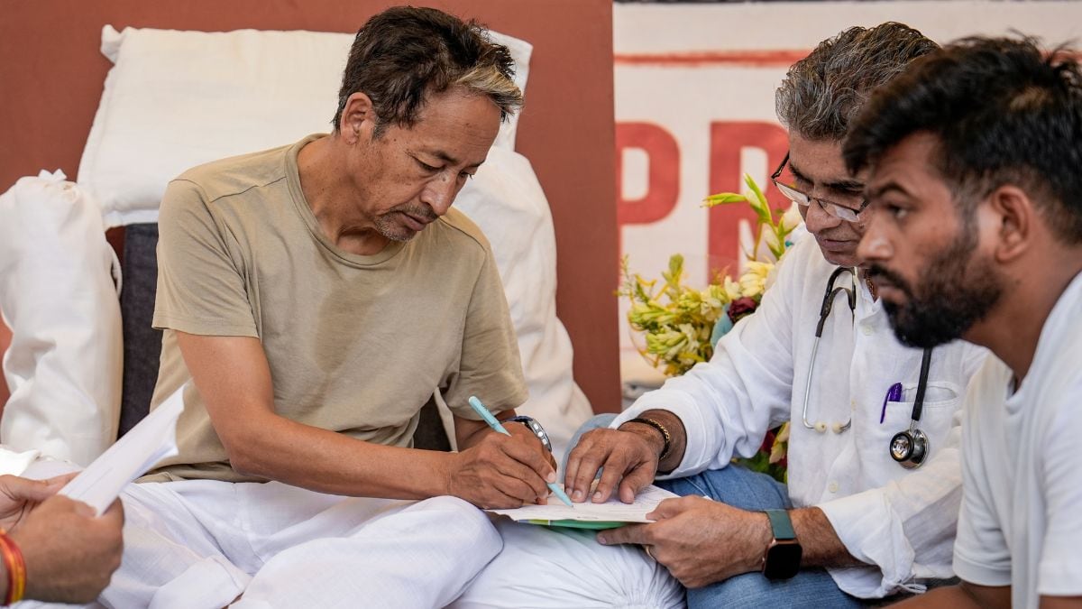 Climate activist Sonam Wangchuk being attended by medical professionals as Cockroach Janata Party (CJP) founder Abhijeet Dipke looks on | PTI