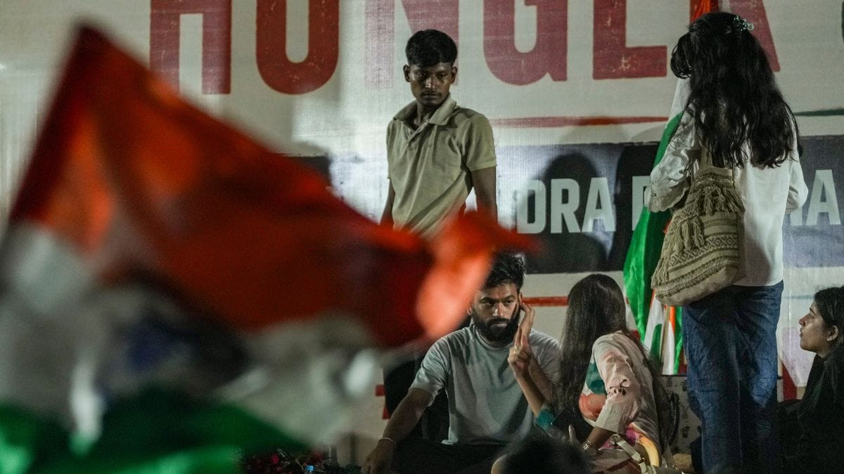 Cockroach Janta Party (CJP) founder Abhijeet Dipke with others during a protest demanding Union Education Minister Dharmendra Pradhan's resignation over alleged irregularities in the NEET examination, at the Jantar Mantar, in New Delhi, on July 19, 2026 | PTI