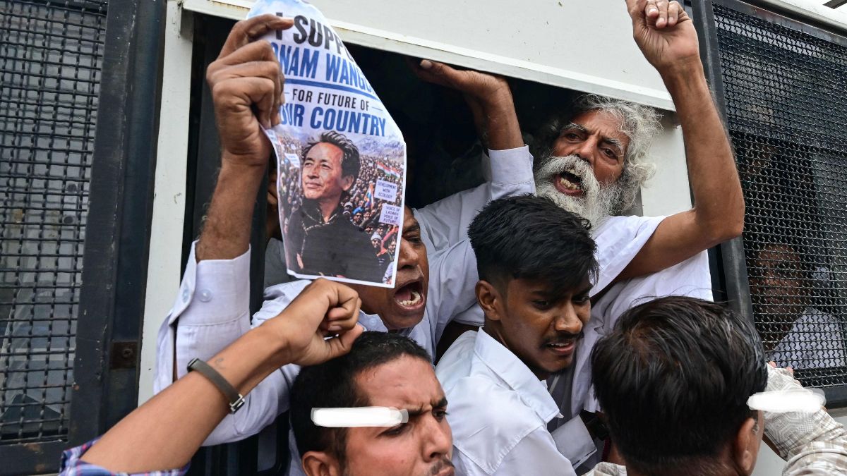 Supporters of the Cockroach Janta Party (CJP) shout slogans as police detain them during a protest demanding the resignation of India's Education Minister Dharmendra Pradhan over alleged NEET examination irregularities in Ahmedabad | AFP 