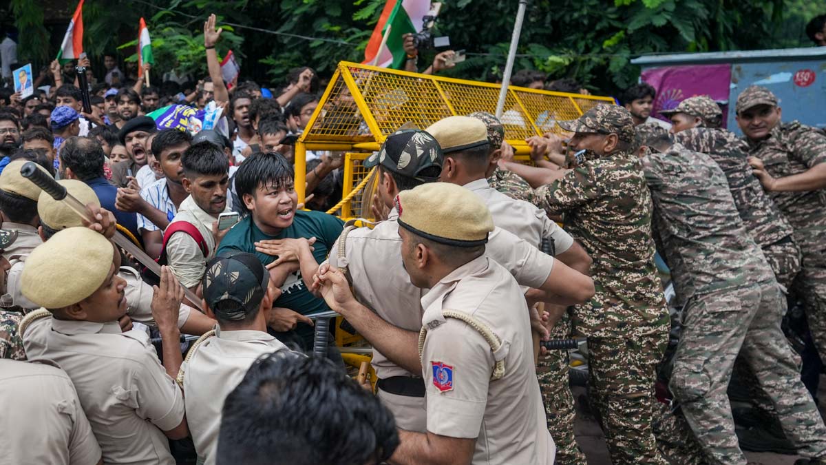 Security personnel stop Cockroach Janata Party (CJP) supporters as they raise slogans near Jantar Mantar ahead of a protest march | PTI