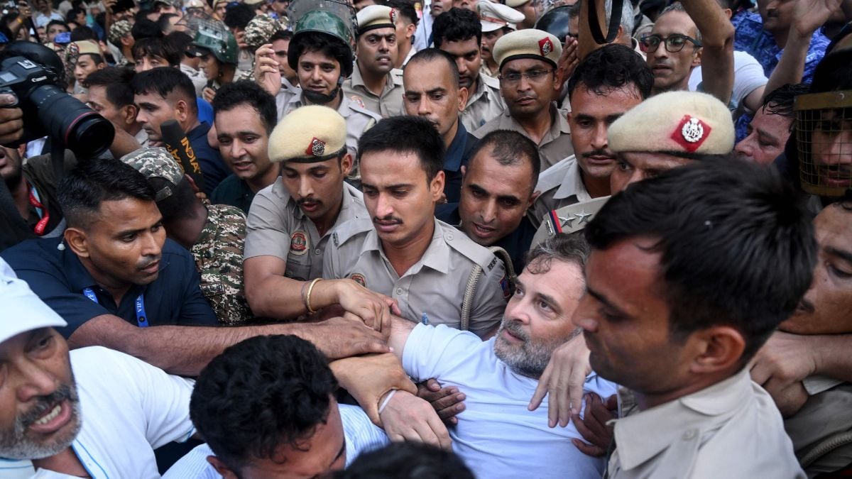 Security personnel detain Rahul Gandhi as he stages a sit-in protest calling for Prime Minister Narendra Modi's resignation outside the latter's residence in New Delhi on July 21, 2026 | AFP