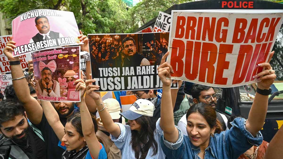 Demonstrators holding posters take part in a protest rally in Mumbai in solidarity with the ongoing protest by the Cockroach Janta Party (CJP) at New Delhi's Jantar Mantar demanding the resignation of Dharmendra Pradhan over alleged NEET examination irregularities | AFP