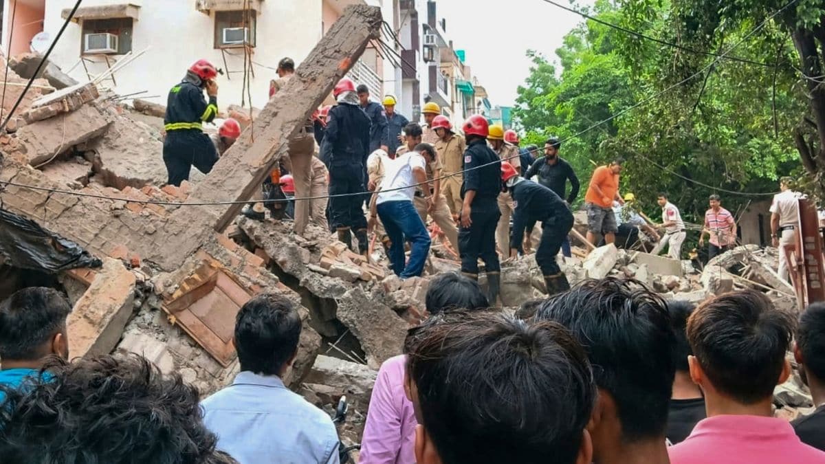 Officials conduct a rescue operation after an under-construction building collapsed at Rohini after heavy rainfall | PTI