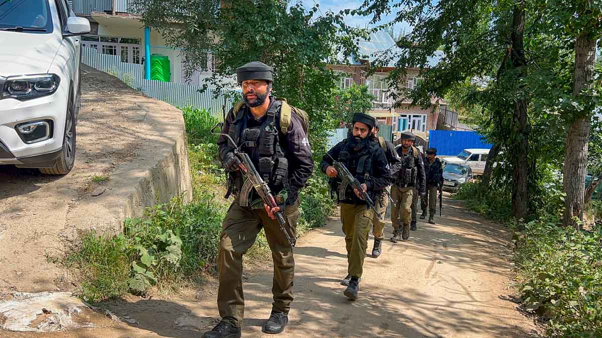 Security personnel keep vigil near the encounter site at Chanapora in Shopian district | PTI