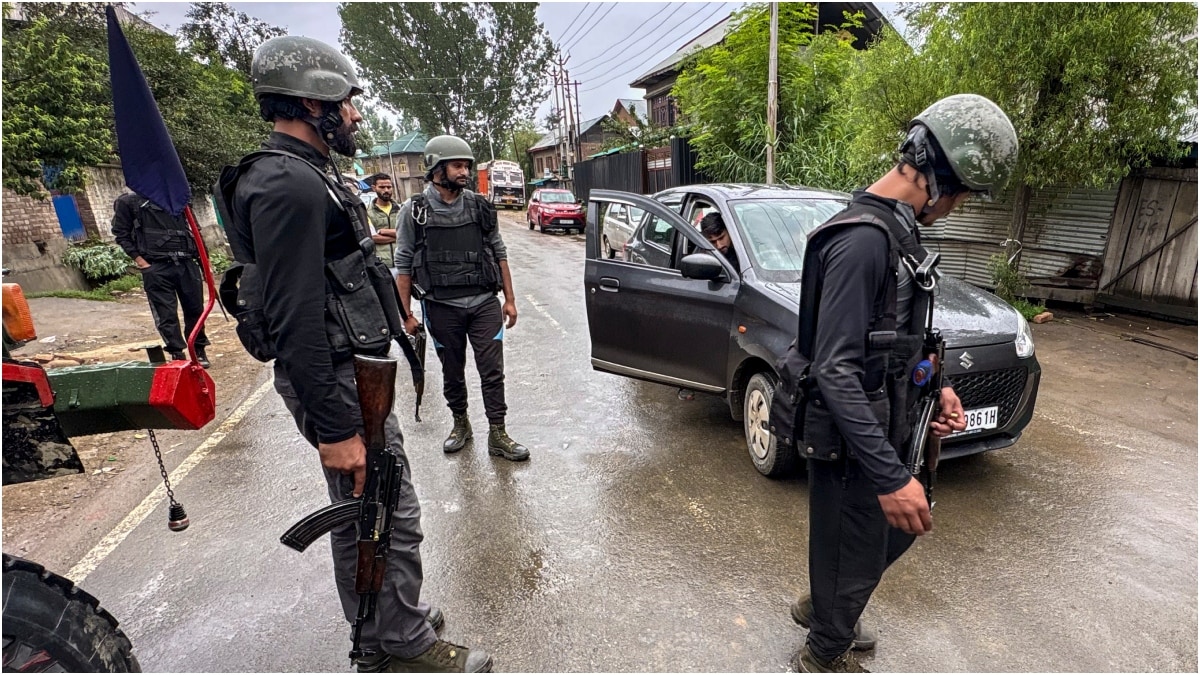 Security personnel conduct a cordon-and-search operation after two labourers from Chhattisgarh were killed in a terrorist attack in J&K's Kulgam district | PTI