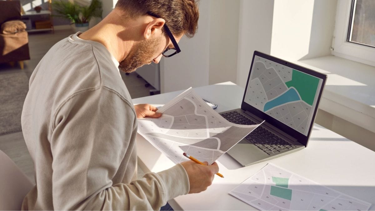 Representative image of a person examining land records | Shutterstock