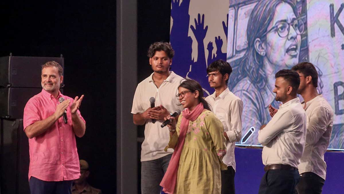 Rahul Gandhi interacts with students on stage during the 'Chhatron Ki Goonj' program, in Prayagraj | PTI
