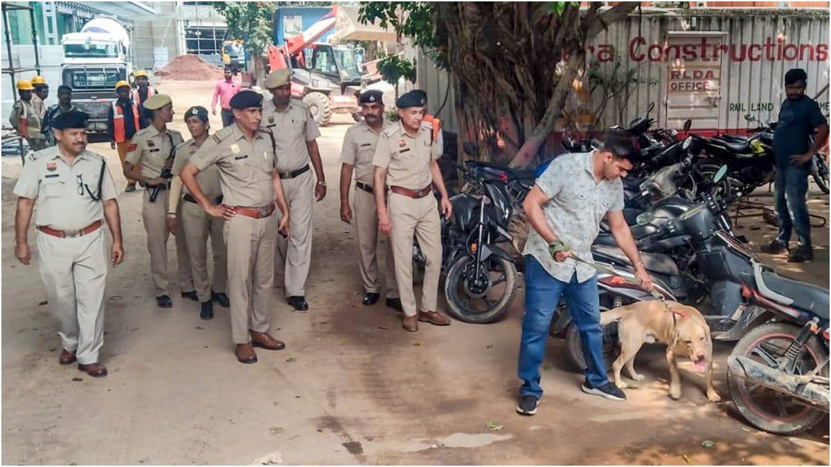 Police officials with a sniffer dog conduct an inspection ahead of Independence Day celebration in NRC's Gurugram | PTI