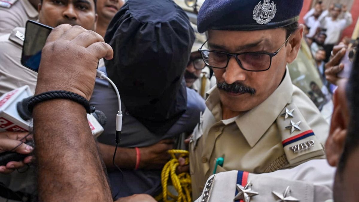 West Bengal Police Special Task Force (STF) personnel escort suspected terrorist Hamid Mondal, also known as Hamim Mondal, with his face covered while producing him before a court in West Bengal | PTI